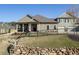 Landscaped front yard with a rock retaining wall and metal fence leading up to the well-maintained home at 57 Cedarcrest Village Ln, Acworth, GA 30101