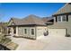 Home exterior featuring green siding, manicured landscaping, and an attached garage at 57 Cedarcrest Village Ln, Acworth, GA 30101