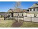 Well-kept home with a green lawn, black fence, and a neutral exterior at 57 Cedarcrest Village Ln, Acworth, GA 30101