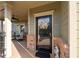 A close-up of a welcoming front porch with brick accents and a charming front door at 57 Cedarcrest Village Ln, Acworth, GA 30101