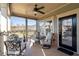 A cozy front porch features comfortable seating and a ceiling fan for relaxing outdoor living at 57 Cedarcrest Village Ln, Acworth, GA 30101