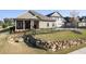 Well-manicured lawn with stone retaining wall and black metal fencing surrounding a cozy single-Gathering home at 57 Cedarcrest Village Ln, Acworth, GA 30101