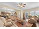 Comfortable living room with a coffered ceiling, ceiling fan, and open access to the kitchen at 57 Cedarcrest Village Ln, Acworth, GA 30101