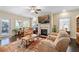 Inviting living room featuring a fireplace, ceiling fan, neutral colors, and a comfortable seating arrangement at 57 Cedarcrest Village Ln, Acworth, GA 30101