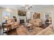 Cozy living room with a fireplace, comfortable seating, and natural light with hardwood floors at 57 Cedarcrest Village Ln, Acworth, GA 30101