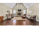 Spacious living room with high ceilings, fireplace, hardwood floors, and large windows for natural light at 57 Cedarcrest Village Ln, Acworth, GA 30101