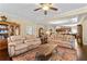 Comfortable living room with coffered ceiling open to the kitchen and dining area, and hardwood flooring at 57 Cedarcrest Village Ln, Acworth, GA 30101