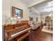 Open concept living room showcasing beautiful hardwood floors, coffered ceiling and seamless flow into dining and sitting area at 57 Cedarcrest Village Ln, Acworth, GA 30101