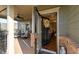 Inviting porch with an open entry featuring brick accents, and a black front door with decorative wreath at 57 Cedarcrest Village Ln, Acworth, GA 30101