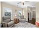 Comfortable sitting room with plush seating, hardwood floors, and natural light from the large windows at 57 Cedarcrest Village Ln, Acworth, GA 30101