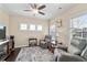 Relaxing sitting room featuring comfortable seating, hardwood floors and natural light from the windows at 57 Cedarcrest Village Ln, Acworth, GA 30101