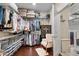 Walk-in closet featuring wire shelving, hardwood floors, safe, and ample storage at 57 Cedarcrest Village Ln, Acworth, GA 30101