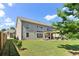 This home features an expansive yard and covered patio providing ample space for outdoor activities and relaxation at 7130 Ansley Park Way, Cumming, GA 30028