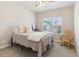 Bedroom with a single bed, neutral colored walls, and a window with natural light at 7130 Ansley Park Way, Cumming, GA 30028