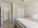 Bedroom with a single bed, neutral colored walls, and access to a closet and hallway at 7130 Ansley Park Way, Cumming, GA 30028