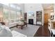 Comfortable living room with built-in bookshelves, fireplace, and lots of natural light at 7130 Ansley Park Way, Cumming, GA 30028