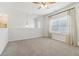 The loft features neutral paint, carpet, and a window with blinds at 7130 Ansley Park Way, Cumming, GA 30028