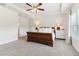Spacious main bedroom with a decorative wood bed frame and white accents throughout at 7130 Ansley Park Way, Cumming, GA 30028