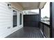 Back porch featuring black railing, black privacy wall, and access to living area through French doors at 1162 Buice Lake Pkwy, Acworth, GA 30102