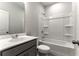 Bathroom with a white tub-shower combination and modern sink at 1162 Buice Lake Pkwy, Acworth, GA 30102