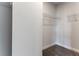 Walk-in closet with wire shelves, neutral walls, and gray carpeting at 1162 Buice Lake Pkwy, Acworth, GA 30102