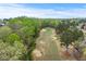 Scenic aerial shot of a well-maintained golf course with mature trees at 3520 Millwater Xing, Dacula, GA 30019