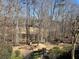 Private backyard with a fire pit and wooded views at 3520 Millwater Xing, Dacula, GA 30019