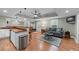 Finished basement area with a wet bar, a seating area, and hardwood flooring at 3520 Millwater Xing, Dacula, GA 30019