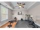 Home gym in a finished basement with workout equipment and a window at 3520 Millwater Xing, Dacula, GA 30019