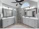 Bright bathroom featuring a double vanity, a large glass enclosed shower, and modern fixtures at 3520 Millwater Xing, Dacula, GA 30019
