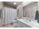 Classic bathroom equipped with a vanity, standard toilet, and tiled flooring, paired with neutral-colored walls at 3520 Millwater Xing, Dacula, GA 30019