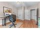 Bright bedroom featuring hardwood floors, overhead light, and neutral decor at 3520 Millwater Xing, Dacula, GA 30019