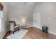 Bedroom featuring hardwood floors, bright window and sitting chair at 3520 Millwater Xing, Dacula, GA 30019