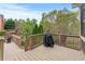 Spacious wooden deck overlooking a landscaped backyard and swimming pool at 3520 Millwater Xing, Dacula, GA 30019