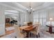 Spacious dining room with hardwood floors and ample natural light, ideal for Gathering meals and entertaining guests at 3520 Millwater Xing, Dacula, GA 30019