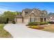 Beautiful home featuring a three-car garage and meticulously maintained landscaping, enhancing curb appeal at 3520 Millwater Xing, Dacula, GA 30019