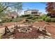 Backyard fire pit with chairs creating a relaxing spot to enjoy nature and outdoor living at 3520 Millwater Xing, Dacula, GA 30019