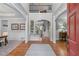 Grand foyer with soaring ceilings, hardwood floors, and elegant staircase, creating a stunning first impression at 3520 Millwater Xing, Dacula, GA 30019