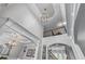 Upper foyer area showcasing high ceilings, elegant architectural details, and natural light, enhancing the home's grandeur at 3520 Millwater Xing, Dacula, GA 30019