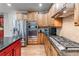 Gourmet kitchen featuring stainless steel appliances, granite countertops, and custom cabinetry at 3520 Millwater Xing, Dacula, GA 30019