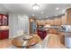 Well-equipped kitchen features stainless steel appliances, granite countertops, and custom cabinets at 3520 Millwater Xing, Dacula, GA 30019