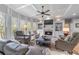 Inviting living room with coffered ceilings, a brick fireplace, and large windows at 3520 Millwater Xing, Dacula, GA 30019