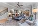 Spacious living room featuring hardwood floors, coffered ceilings, and an open floor plan at 3520 Millwater Xing, Dacula, GA 30019