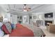 Elegant bedroom with a fireplace, tray ceilings, and an attached ensuite bathroom at 3520 Millwater Xing, Dacula, GA 30019