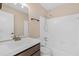 Bright bathroom with a single sink vanity and shower-tub combination at 1184 Red Oak Cv, Tucker, GA 30084