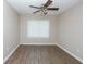 Bedroom featuring wood floors, a ceiling fan, and natural light at 1184 Red Oak Cv, Tucker, GA 30084