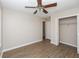 Cozy bedroom with wood floors, a ceiling fan, and a closet at 1184 Red Oak Cv, Tucker, GA 30084
