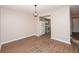 Dining room featuring wood floors and entrance to kitchen at 1184 Red Oak Cv, Tucker, GA 30084