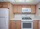 Modern kitchen featuring stainless steel appliances and light wood cabinetry at 1184 Red Oak Cv, Tucker, GA 30084