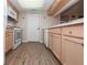 Well-lit kitchen featuring light wood cabinets and modern appliances at 1184 Red Oak Cv, Tucker, GA 30084